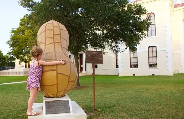 Girl Hugging Peanut in Downtown Floresville